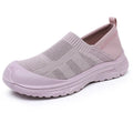 Women's black oversleeve shoes with round toe and soft flat PVC sole.
