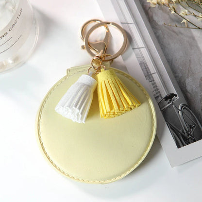 Mini round PU leather small mirror with tassel in various colours