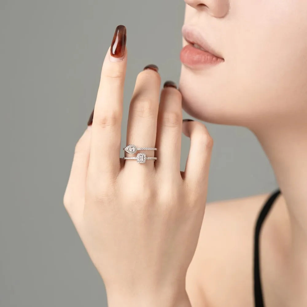 S925 sterling silver water drop double-layer hollow ring platinum finish geometric design on white background