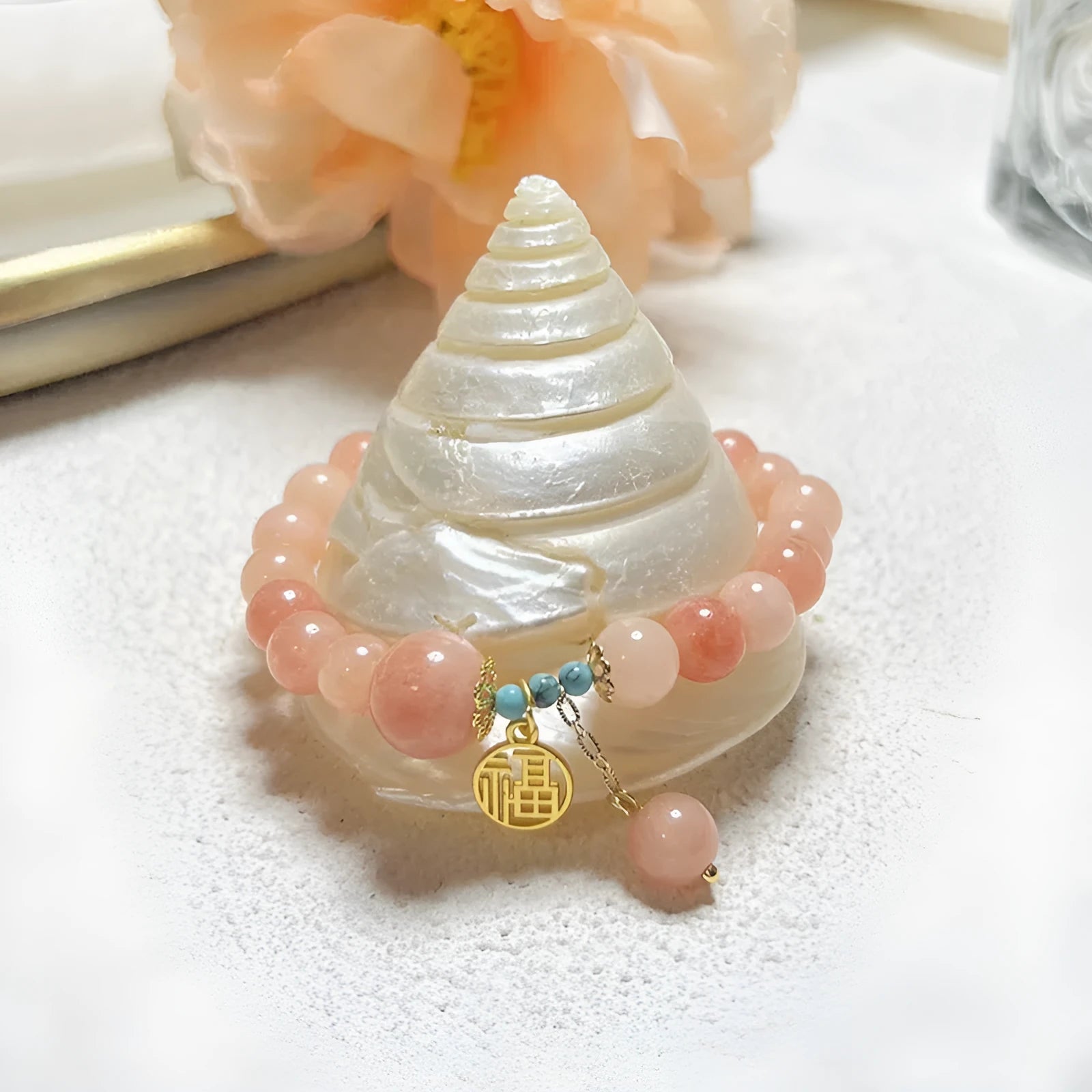 Women's pink natural stone bracelet with alloy metal setting and adjustable clasp