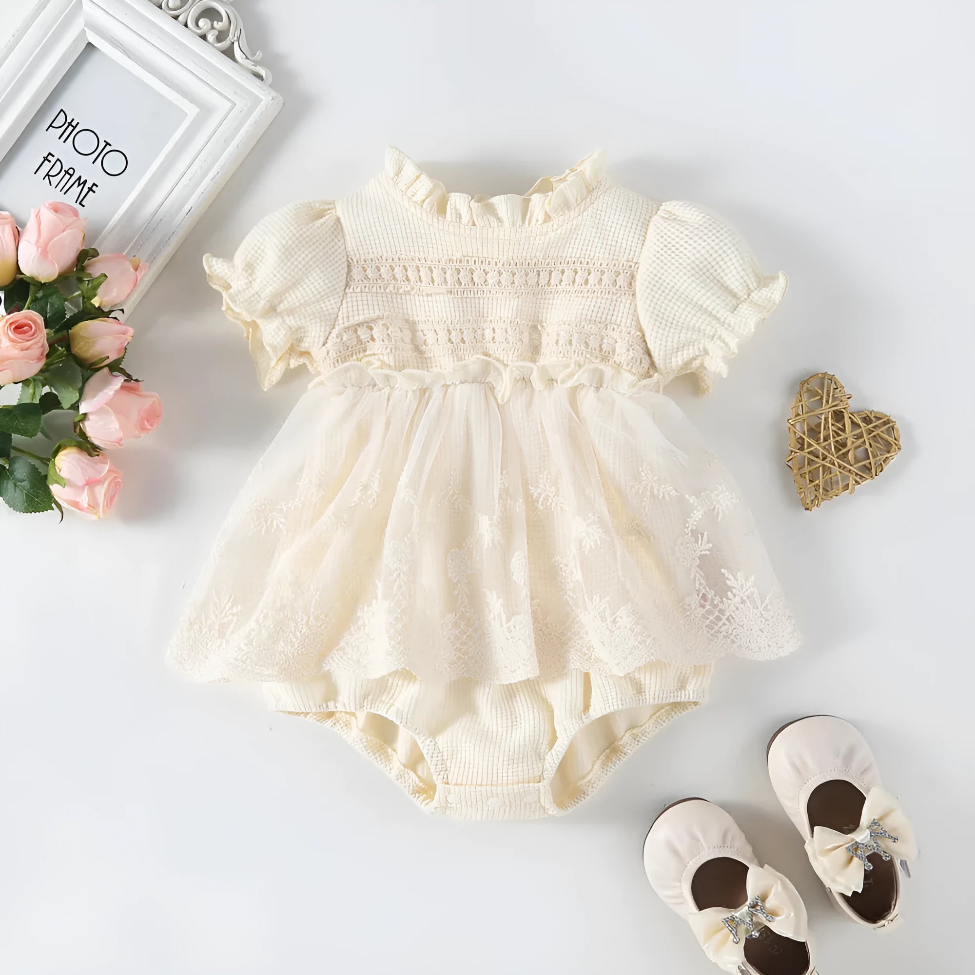 Apricot cotton triangle jumpsuit for girls with short sleeves and single-breasted closure on a white background