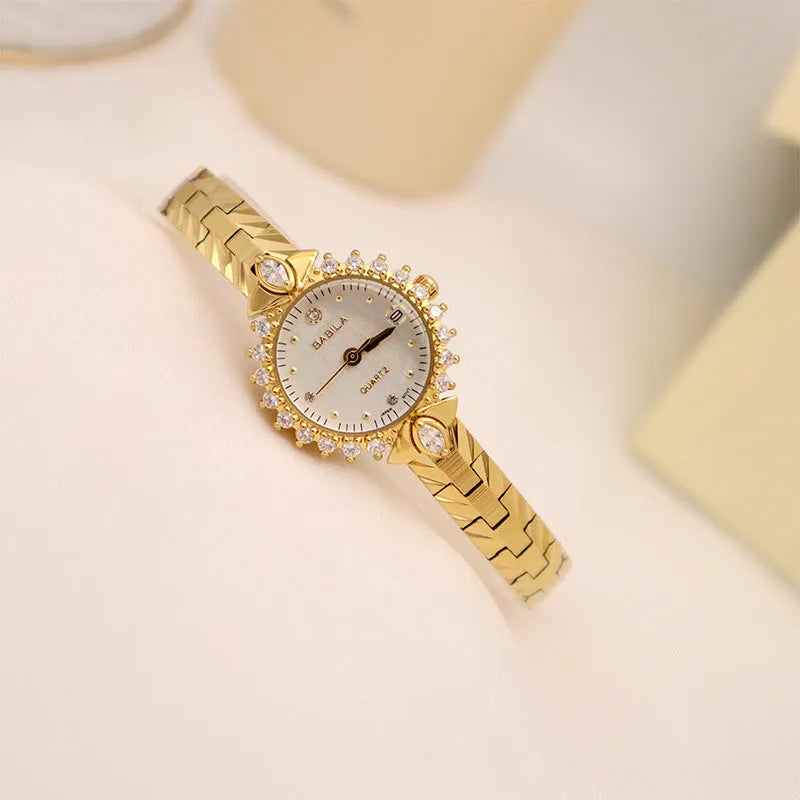Women's vintage quartz bracelet watch with gold surface showing 6mm thickness and diamond embossed detail