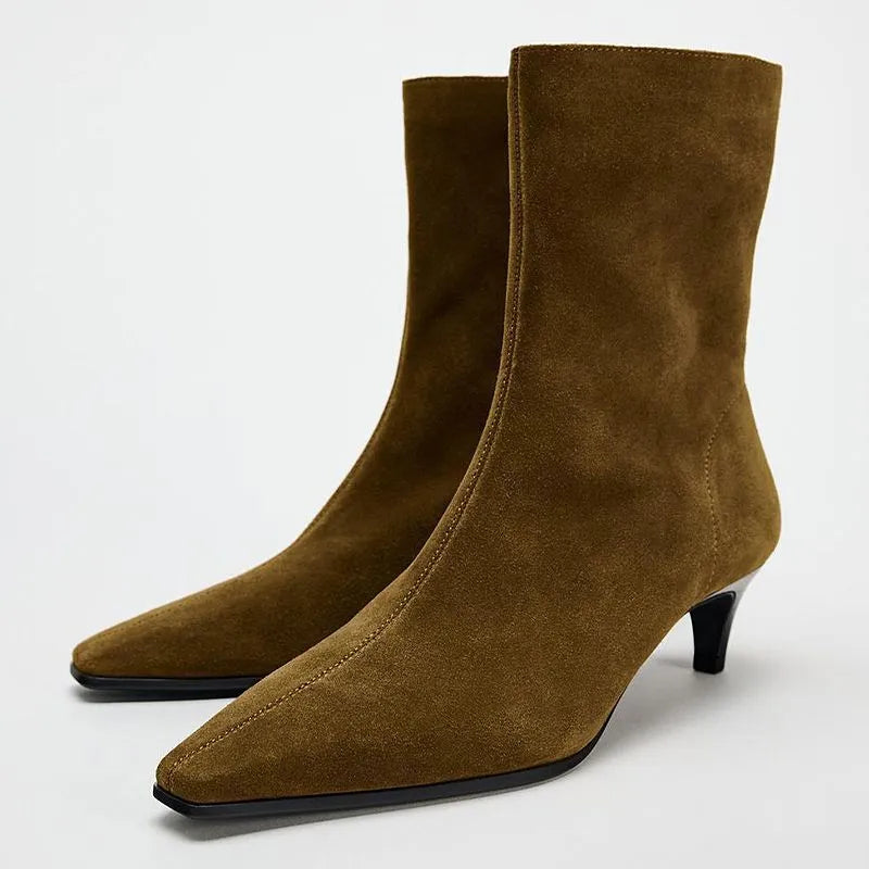Brown women's square toe ankle boots with a side zipper and a mid-height stiletto heel on a waterproof platform sole.