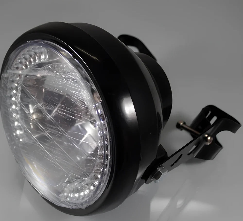 7-inch black ABS motorcycle headlight with yellow LED turn signals and adjustable brackets for cafe racer fit