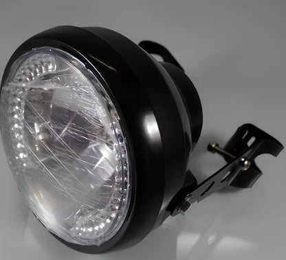 7-inch black ABS motorcycle headlight with yellow LED turn signals and adjustable brackets for cafe racer fit