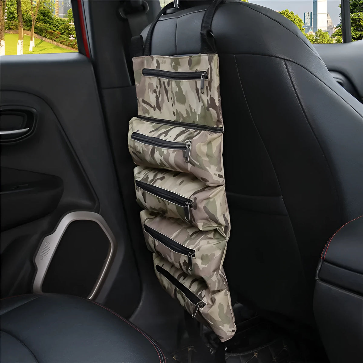 Car seat back tool organiser in camouflage Oxford cloth with five zippered pockets rolled up