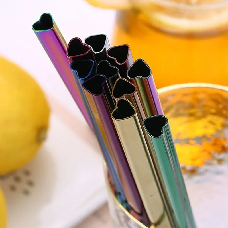 Reusable heart-shaped stainless steel straws in various colours with cleaning brush