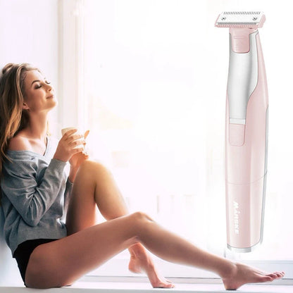 Portable hair shaver in pink and green with detachable comb for precise styling