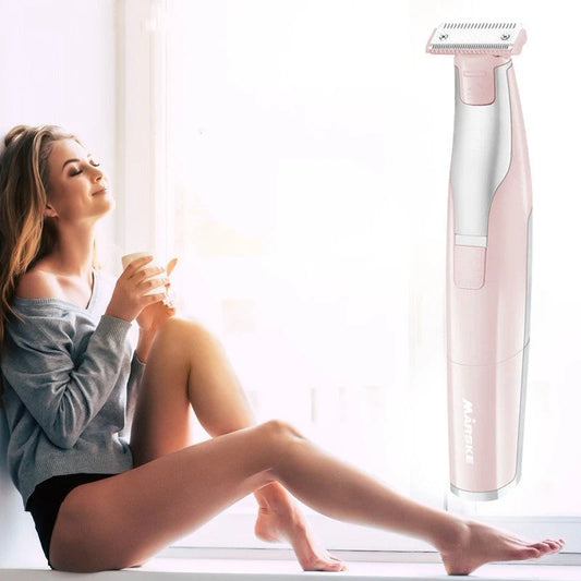 Portable hair shaver in pink and green with detachable comb for precise styling