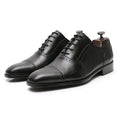 Men's black cowhide Oxford brogue shoes with rubber sole and sewn thread detail