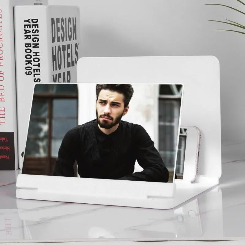 Black portable phone screen amplifier with integrated smartphone holder showing 9-inch plexiglass screen