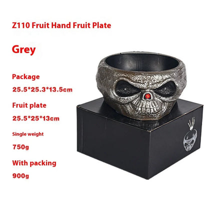 Motion-activated Halloween pumpkin candy bowl with spooky skeleton hand and glowing red eyes