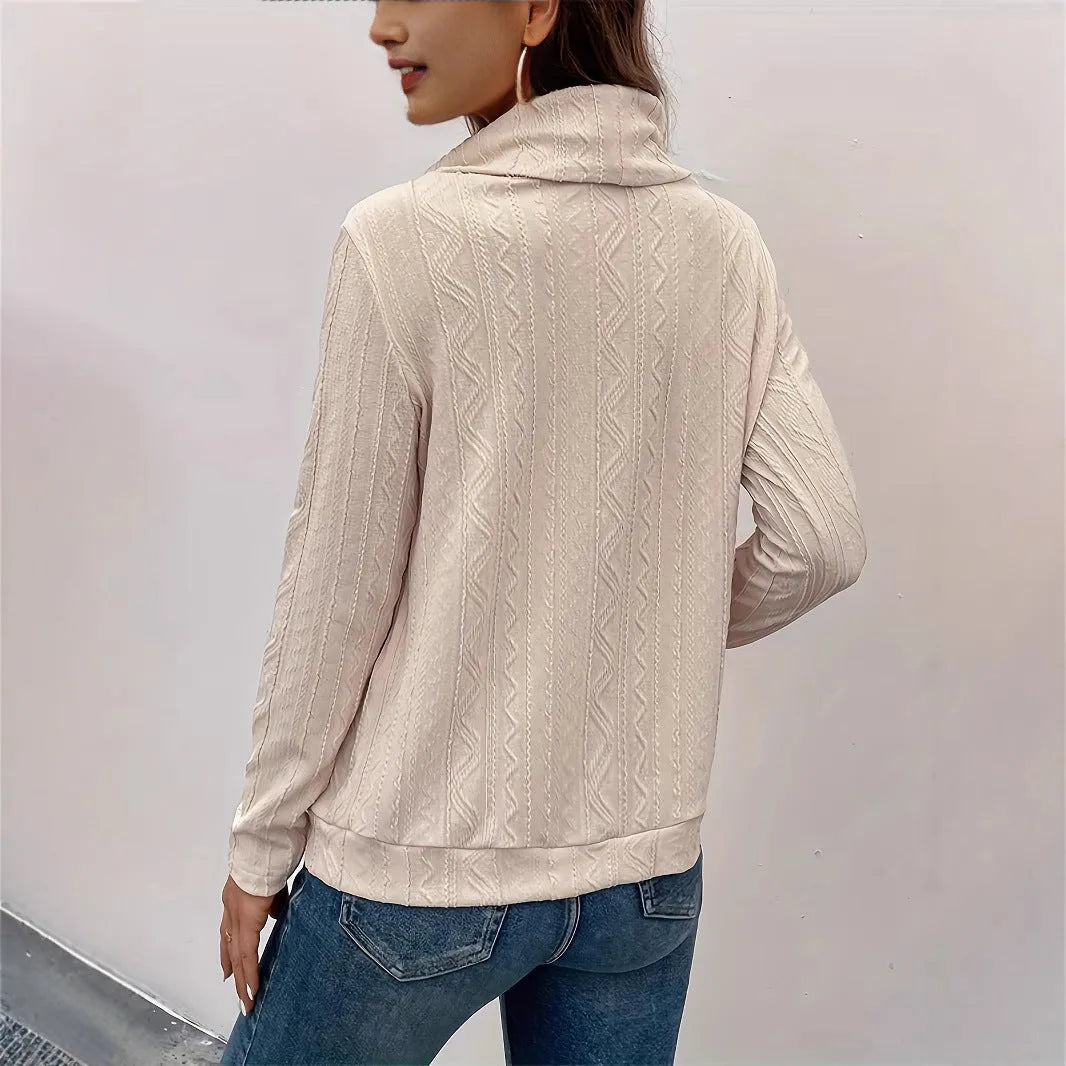 Apricot hooded pullover sweater with drawstring and long sleeves on hanger