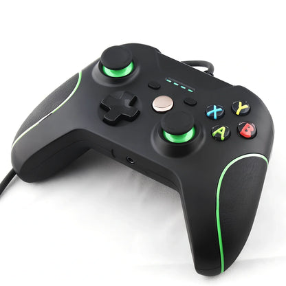 White Xbox One wired USB game controller with ergonomic grips and 2.5m cable on plain background