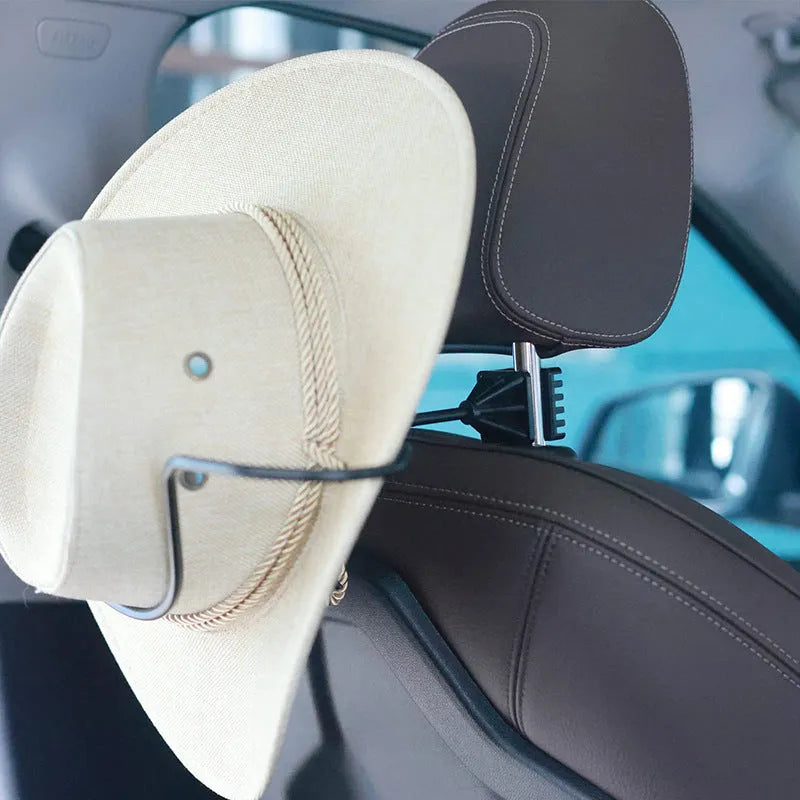 Black metal snap-on hat bracket mounted on a car rearview mirror
