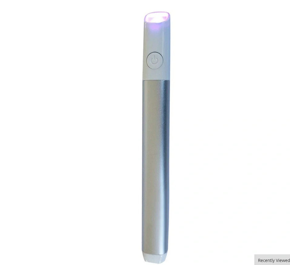 Silver grey acne treatment device with red and blue light therapy, battery-powered design
