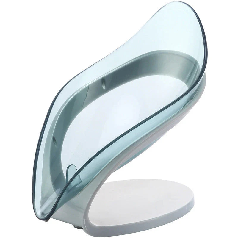 Self-draining leaf-shaped soap dish made of durable ABS material, featuring a unique triangle structure to prevent soap from slipping