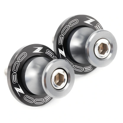 Pair of 8mm CNC aluminium swingarm spools sliders in titanium for Kawasaki Z650 Z900, with Delrin contact and stainless bolts