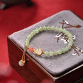 Jade women's bracelet with gold gourd sense design and fu character symbol, 6mm gold plated finish