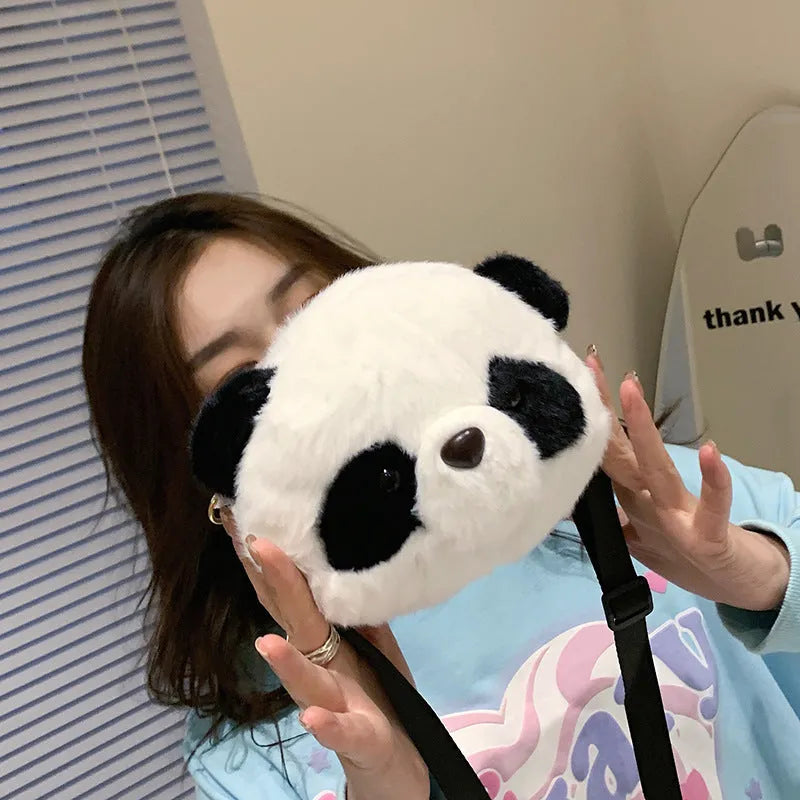 Soft plush panda head design cylindrical crossbody messenger bag with a sandwich pocket.