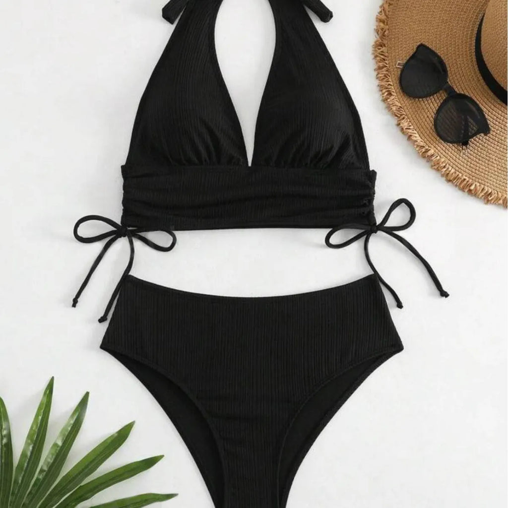 Women's black lace-up halter bikini set with matching briefs on white background