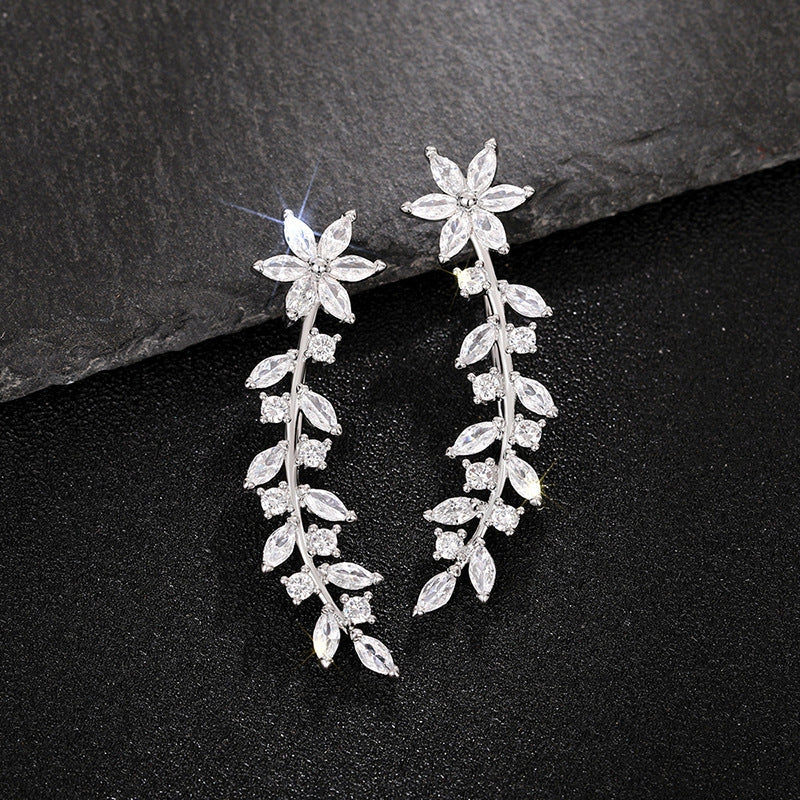 Floral diamond earrings for women in white gold, gold, and rose gold finishes