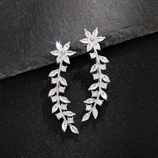 Floral diamond earrings for women in white gold, gold, and rose gold finishes