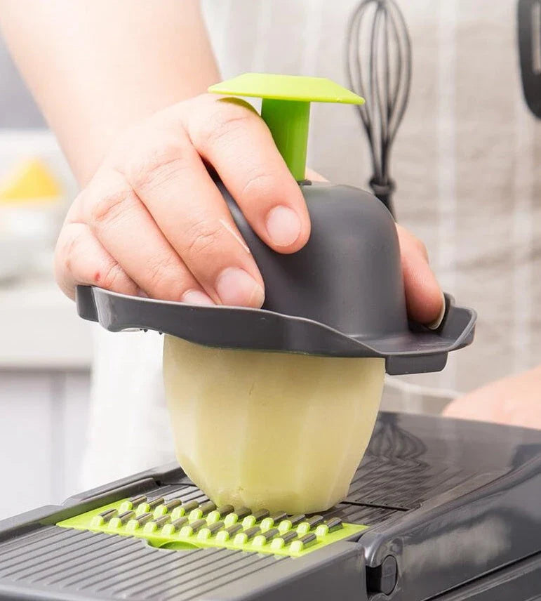 Versatile vegetable slicer with interchangeable blades for slicing, dicing, and shredding a variety of fruits and vegetables