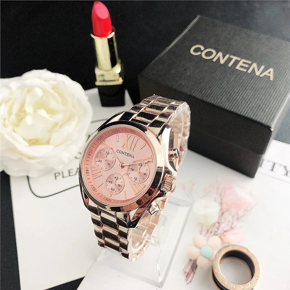Women's silver rose gold diamond quartz analogue watch with mesh strap on wrist