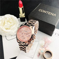 Women's silver rose gold diamond quartz analogue watch with mesh strap on wrist