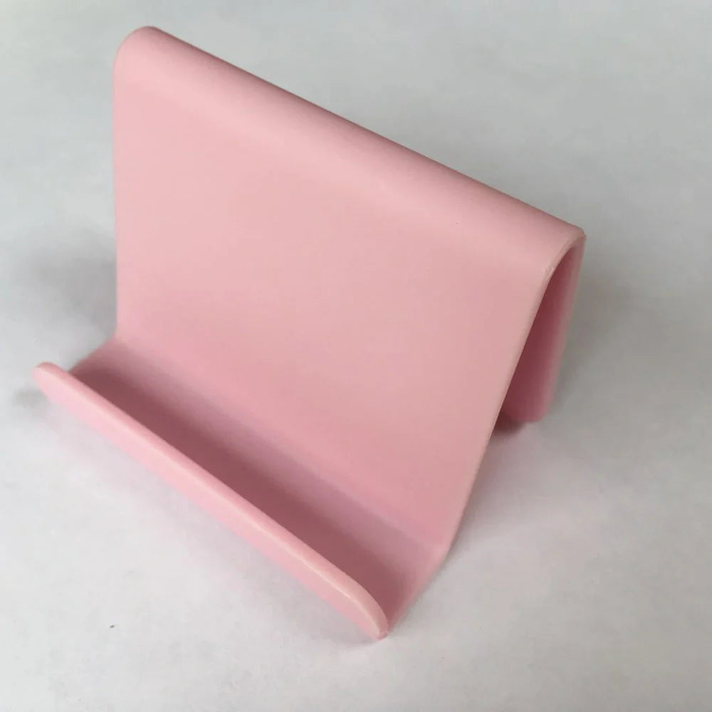 Candy colour plastic phone holder showing 6cm width and 4.5cm height dimensions