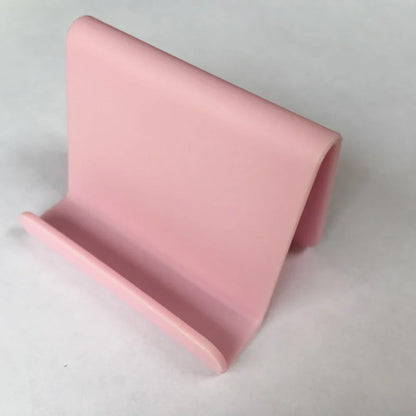 Candy colour plastic phone holder showing 6cm width and 4.5cm height dimensions