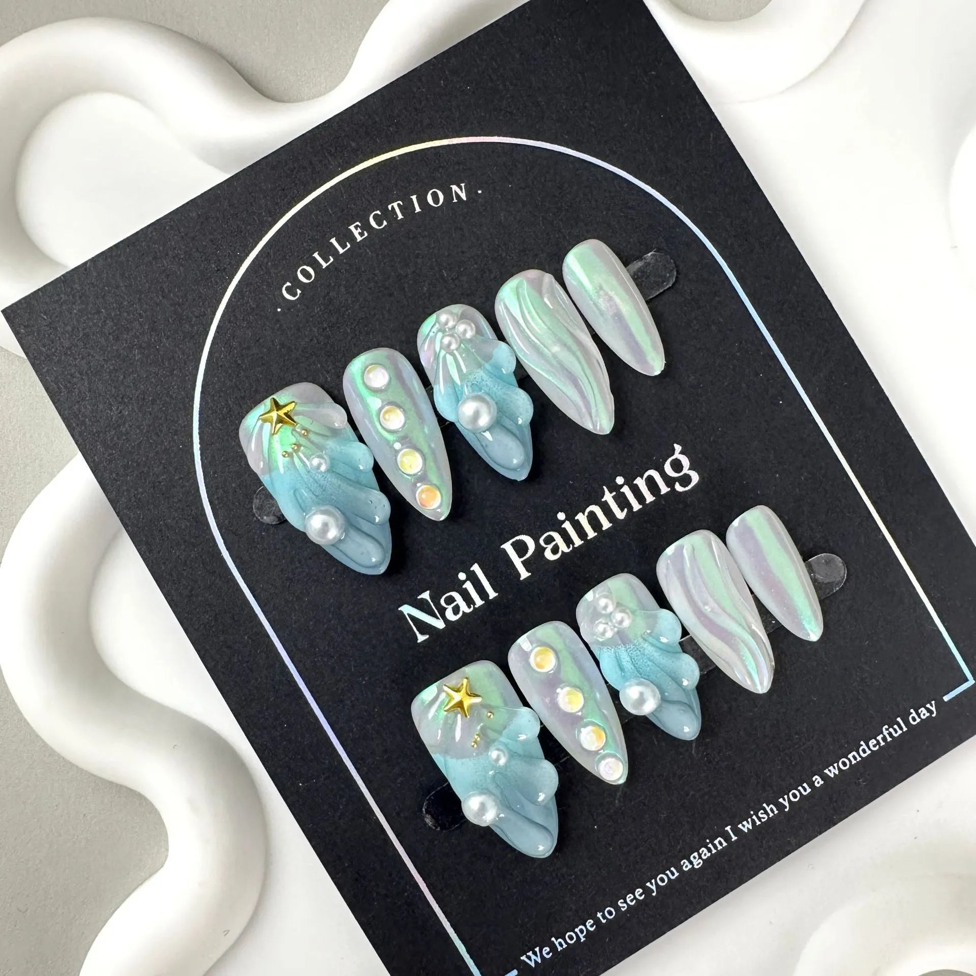 Blue plastic shell-shaped artificial nail stickers in four sizes XS S M L