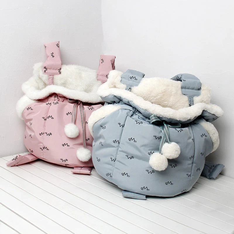 Winter travel pet chest backpack in blue and pink, designed for small pets