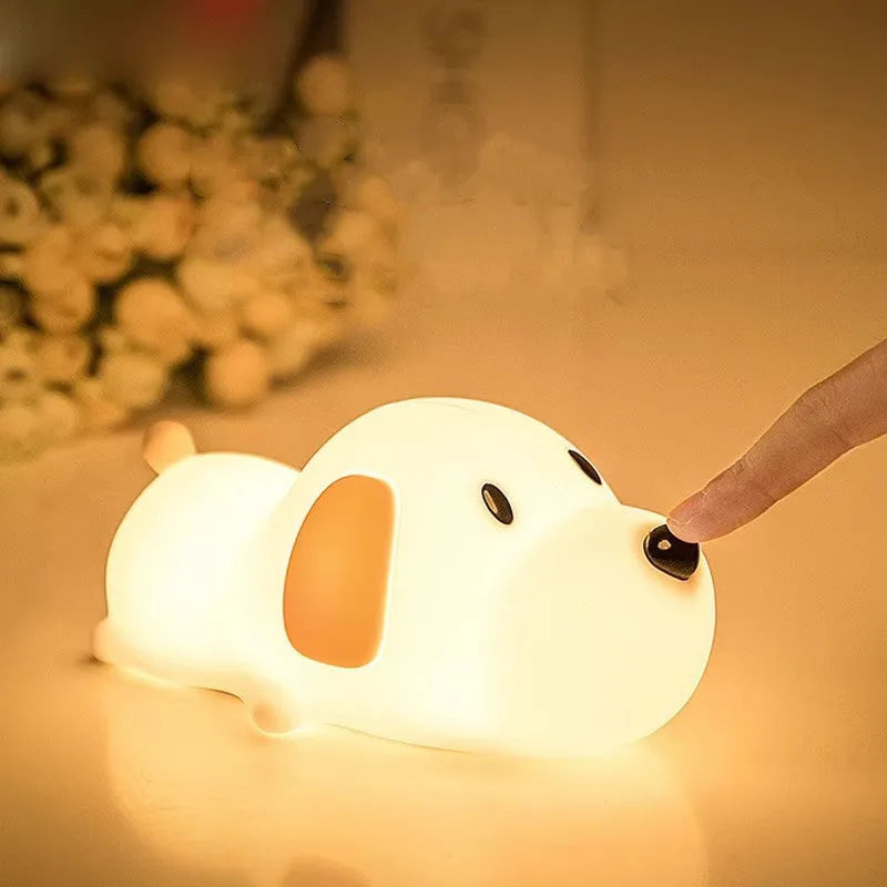 Silicone cartoon dog night light with two-colour design, powered by a USB cable.