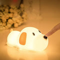 Silicone cartoon dog night light with two-colour design, powered by a USB cable.