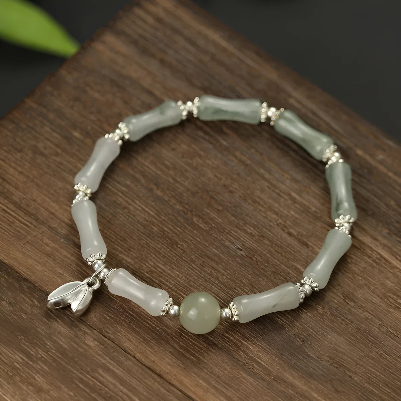 Women's antique-style bracelet made from Tianshan green bamboo and sterling silver with bamboo joint detailing.
