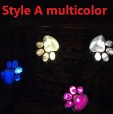 Black solar powered animal paw print LED garden lights set of four with central solar panel
