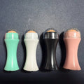 Portable black volcanic stone facial roller for oily skin control and makeup touch-ups.