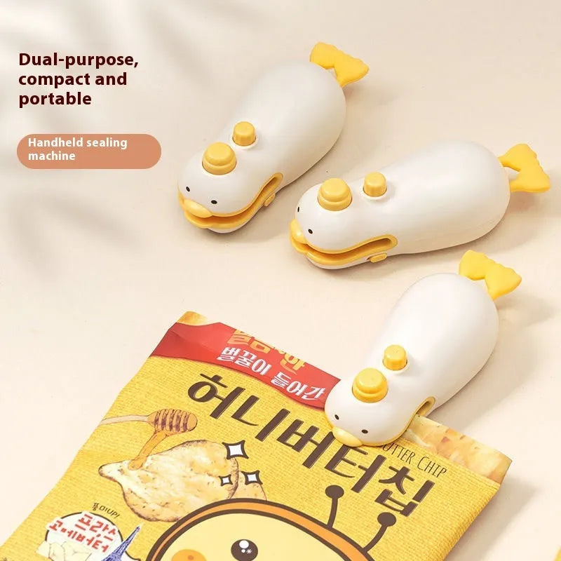 Small Yellow Duck shaped rechargeable bag sealer with animal jacquard pattern and USB cable.