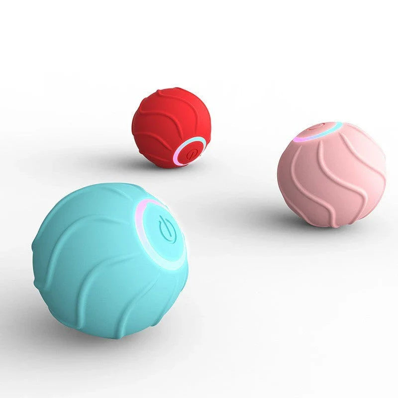 Automatic, self-bouncing cat toy balls in vibrant blue, red, and pink colors