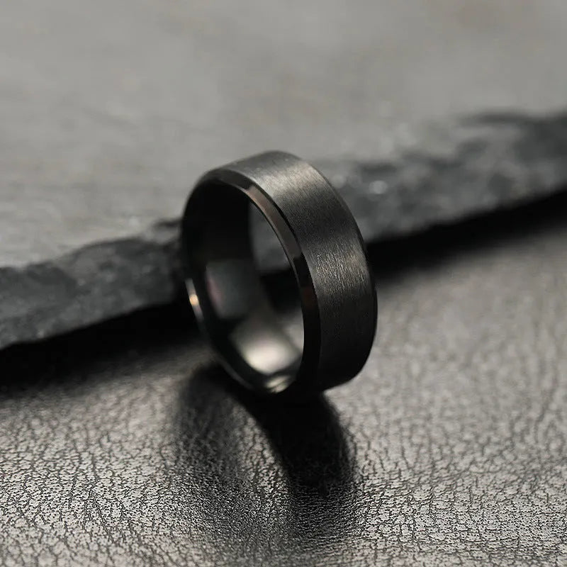 Titanium steel ring with electroplated matte finish in black, unisex geometric round design, available in sizes 6-13