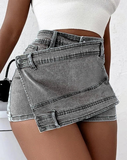 Stylish Y2K-inspired denim shorts with an asymmetrical hem, offering a trendy and comfortable fit.