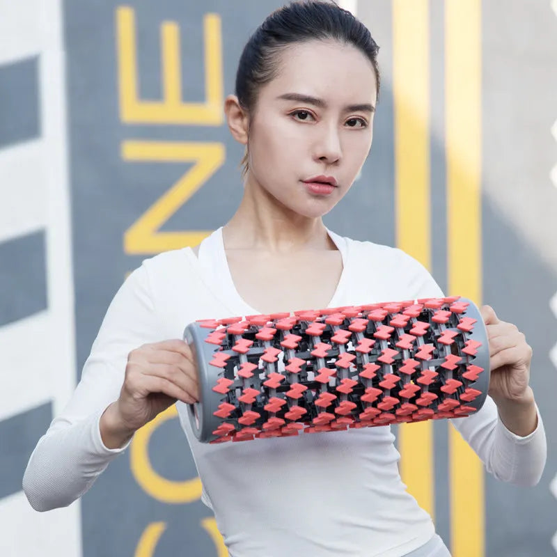Adjustable telescopic foam roller in red, black, pink or yellow for muscle recovery massage