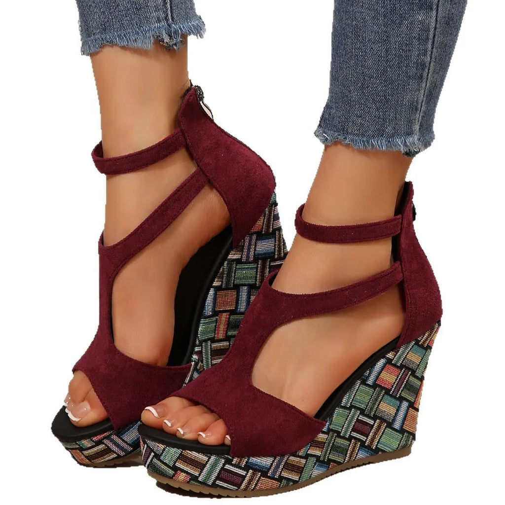 Women's beige wedge sandals with a thick rubber sole and buckle ankle strap on a cloth upper.