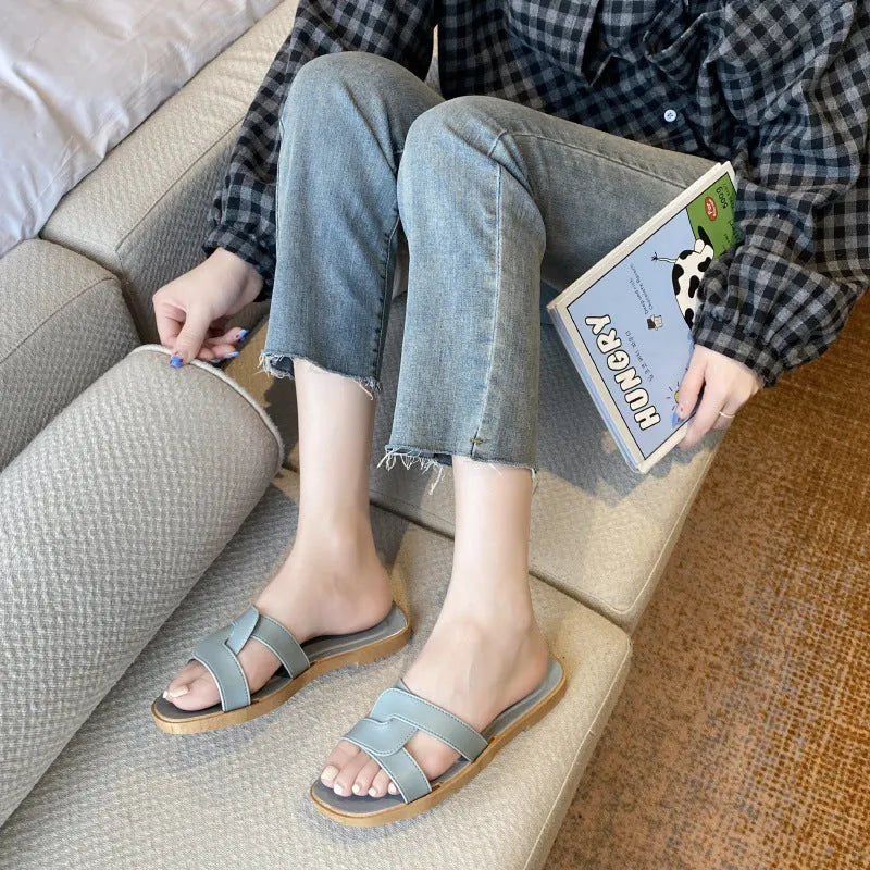 Women's PVC cross-strap flip-flop sandals in milky white, shown for home casual wear.