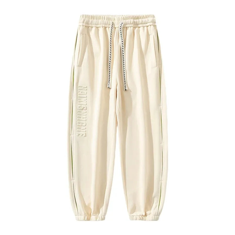 Men's grey green loose fit jogger pants with elasticated ankle bands and waist.