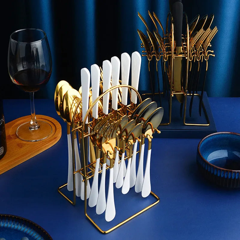 24-piece stainless steel cutlery set with storage rack in gold finish showing knives, forks, spoons