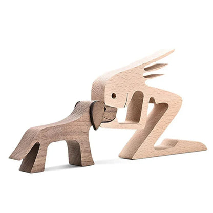 Handcrafted wooden dog sculpture featuring a man and his loyal canine companion