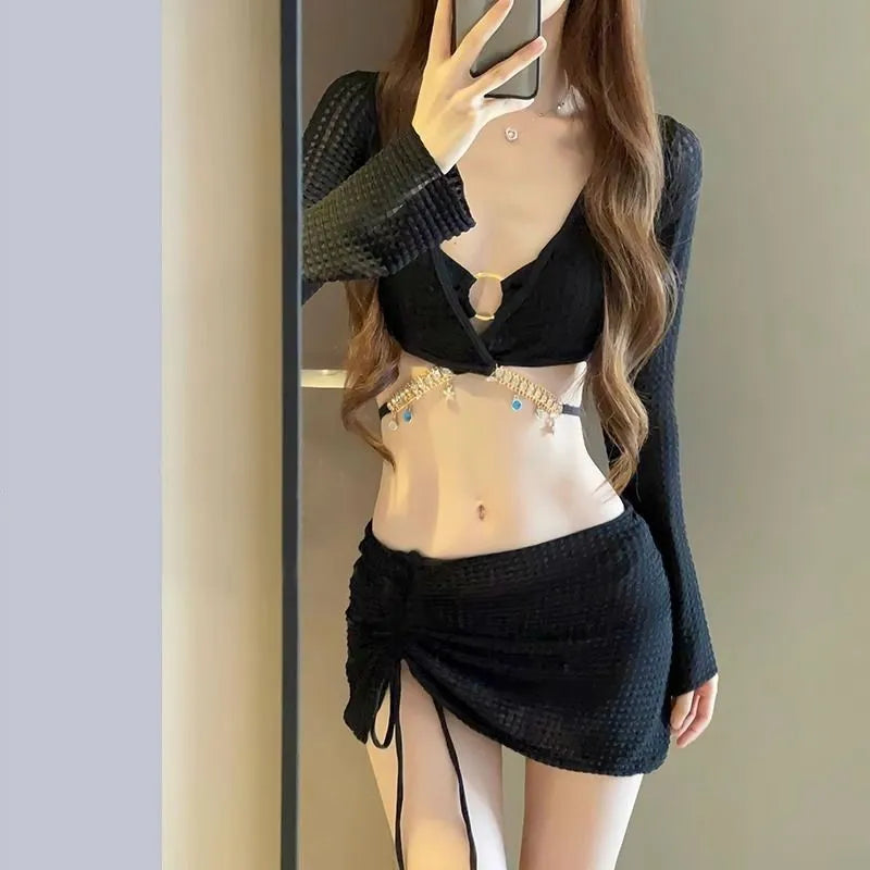 Women's long sleeve black and white bikini swimsuit with split bottoms for swimming